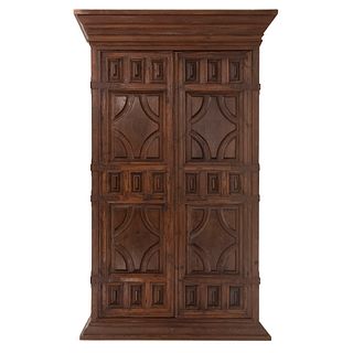Wardrobe. 20th century. Carved in wood. Two hinged doors and base supports.