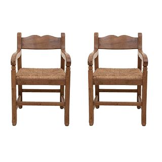 Lot of 2 armchairs. Mexico. 20th century. Carved in wood. Woven palm seat straight supports.