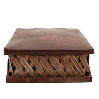 Footstool. 20th century. Rustic style. Carved in wood. Brown, leather-like seat. 