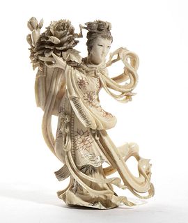 A Chinese ivory carving depicting He Xiangu - Qing dynasty, late 19th Century