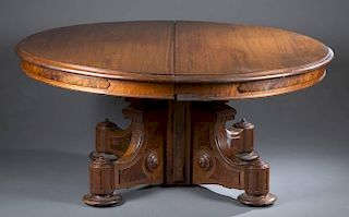 Dining table with carved pedestal base.