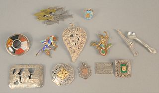 Ten silver pins, two with enamelling, one with gold mounts, one mounted with stones, two medallions, 4.5 t.oz. .