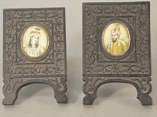 Pair of mid-eastern miniature portraits in carved hardwood frames, image: 1 1/2" x 1 1/4", frame: 4 3/4" x 3".