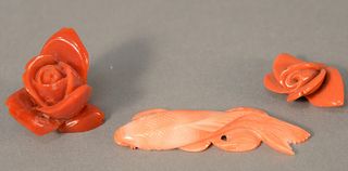 Three carved pieces of coral, large red coral rose, small red coral flower and a carver coral fish, lg. 2 1/2". Provenance: The Estate of Ed Brenner, 