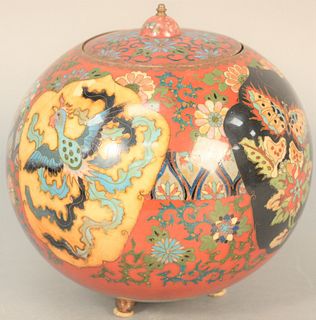 Japanese cloisonne enamel ball covered jar decorated with butterflies and phoenix birds raised on three feet, ht. 9", with repairs. Provenance: The Es