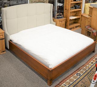Contemporary king size bed having upholstered head with rivets along with stained wood rails and footboard, ht. 52". Estate of Marilyn Ware Strasburg,