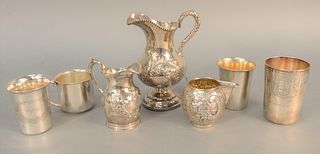Silver lot to include three-piece repousse tea set along with four cups, pitcher ht. 7", Estate of Tom & Alice Kugelman.
