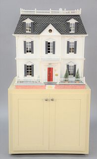 Dollhouse on base having two drawers along with miscellaneous figures and furniture, dollhouse ht. 34", wd. 31 1/2", dp. 25".