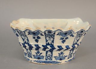Delft blue and white hanging flower holder, painted with basket and flowers, 18th C. or later, repaired, ht. 4 3/4", lg. 9 1/4".