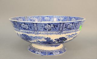 Large English blue and white footed punch bowl having transferware decorated flower panels and landscape scenes (spider crack on interior), ht. 9", di