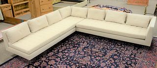 Contemporary upholstered two-piece sectional having tufted seat, ht. 27", lg. 108" x 121".