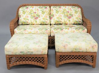 Five-piece wicker lot to include two loveseats, lg. 66" along with two ottomans (all with cushions) and a glass top coffee table.