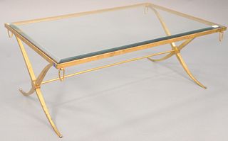 Contemporary glass top coffee table having bevelled glass on a gilded iron base, ht. 19", top 32" x 48".