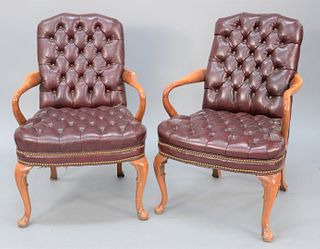 Pair of tufted leather armchairs.