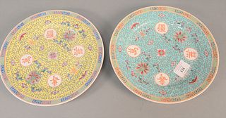 Two sets of Chinese porcelain plates, seventeen Famille Rose dia. 10" with blue ground, and thirteen with yellow ground dia.10".