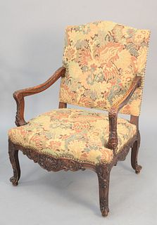 Heavily carved French-style armchair having needlepoint upholstery, ht. 41 1/2", wd. 30".