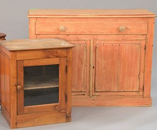 Two-piece pine lot to include chest, ht. 36", wd. 48" having long drawer over two doors along with one door side table.