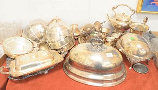 Silver plated lot with revolving tureen, large entree cover, tray, seven small entree covers, a teapot, regular size cover, etc. Provenance: A South E