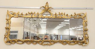 Carved gilt three-part over mantle mirror, 18th - 19th C., 29" x 55".