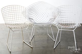 Six Bertoia wire chairs.