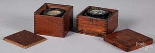 Two cased compasses