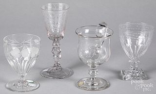 Four pieces of etched colorless glass