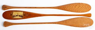 Three miniature canoe paddles