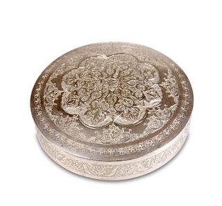 A PERSIAN SILVER BOX, circular with lift-off cover, chased with a lotus flo