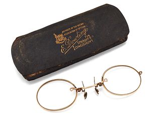 A PAIR OF GOLD PLATED PINCE-NEZ, the oval glasses with plain frames and wir