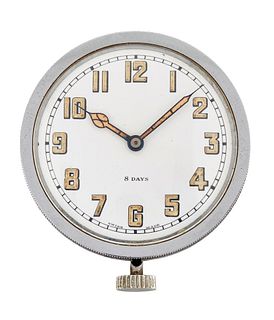 AN 8 DAY DASHBOARD CLOCK. Circular white dial with ivory arabic numerals an