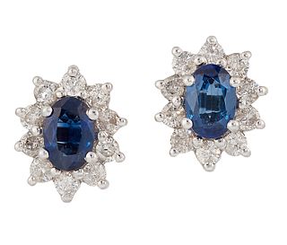 A PAIR OF SAPPHIRE AND DIAMOND CLUSTER EARRINGS, the oval sapphires, total 