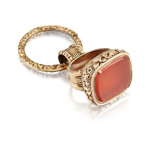 A LATE 19TH CENTURY HARDSTONE FOB, the rectangular carnelian fob in a deep 