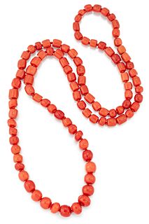 A CORAL BEAD NECKLACE, the individually knotted strand of beads of roughly 