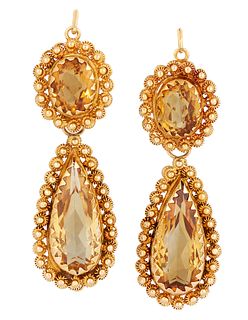 A PAIR OF CITRINE EARRINGS,?the oval citrine drops, in collet and claw moun