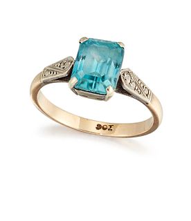A 9CT BLUE ZIRCON RING, the emerald cut zircon, in a four-claw mount with q
