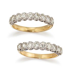 A PAIR OF 18CT DIAMOND HALF ETERNITY RINGS, each ring with nine round brill