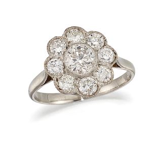 A DIAMOND FLOWERHEAD CLUSTER RING, the central round old brilliant cut diam