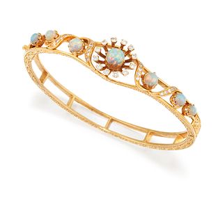 A 14CT OPAL AND DIAMOND BANGLE, the central round opal cabochon surrounded 