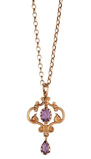 A 9CT AMETHYST PENDANT AND CHAIN, the Edwardian style pendant set with an a