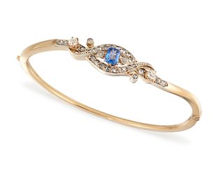 A SAPPHIRE AND DIAMOND BANGLE, the octagonal sapphire, estimated approx. 0.