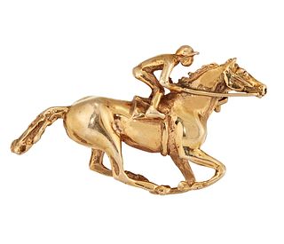 A 9CT GOLD RACEHORSE BROOCH,?the racehorse and jockey at full gallop, 35mm 