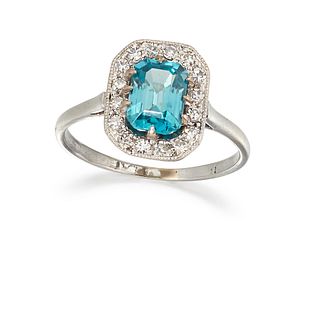 A ZIRCON AND DIAMOND RING, the blue octagonal zircon, claw mounted and surr