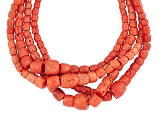 A FOUR ROW CORAL BEAD NECKLACE, the graduated coral beads between approx. 5