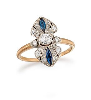 A SAPPHIRE AND DIAMOND DRESS RING
 The elongated openwork plaque, centred b