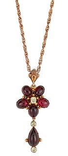 A LATE 19TH CENTURY GARNET PENDANT NECKLACE, the oval garnet cabochons, wit