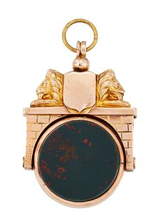 A DOUBLE SIDED HARDSTONE FOB, the round fob set with carnelian to one side 