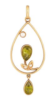 A PERIDOT AND SEED PEARL PENDANT, the open pear shape frame set with a pear