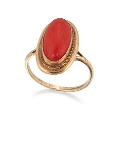 A 9CT CORAL RING, the oval coral cabochon, collet mounted with rope twist b