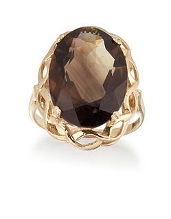 A 9CT SMOKEY QUARTZ RING, the oval faceted smokey quartz in a four-claw mou