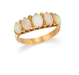 A FIVE STONE OPAL RING, the five graduated oval opals, claw mounted to a pl